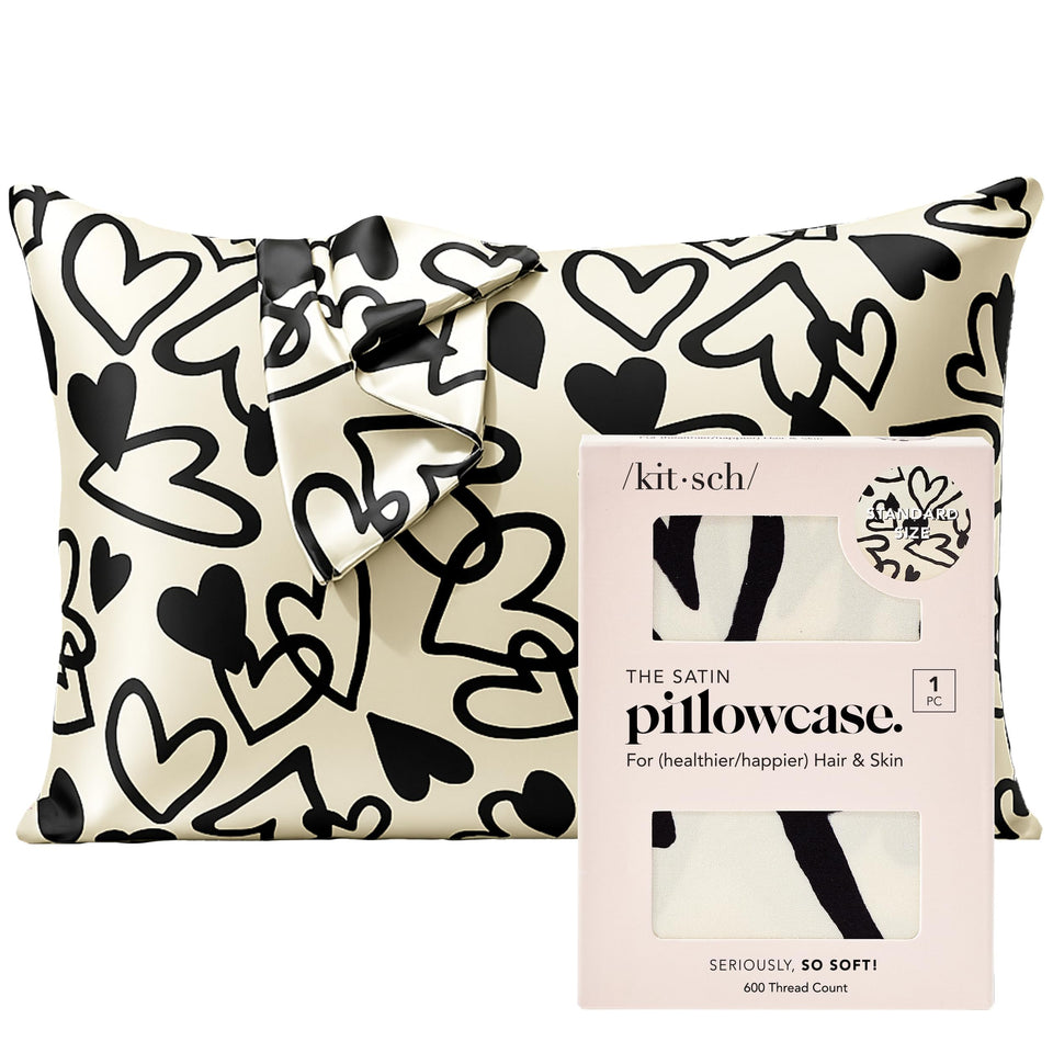 Kitsch satin pillowcase with heart closure close-up shows secure fit for a tidy sleep