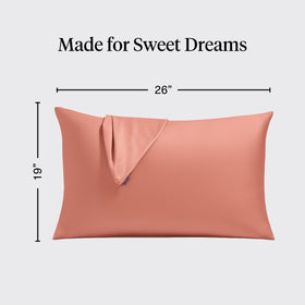 Kitsch satin pillowcases two-pack laid on bed show wrinkle-free look.