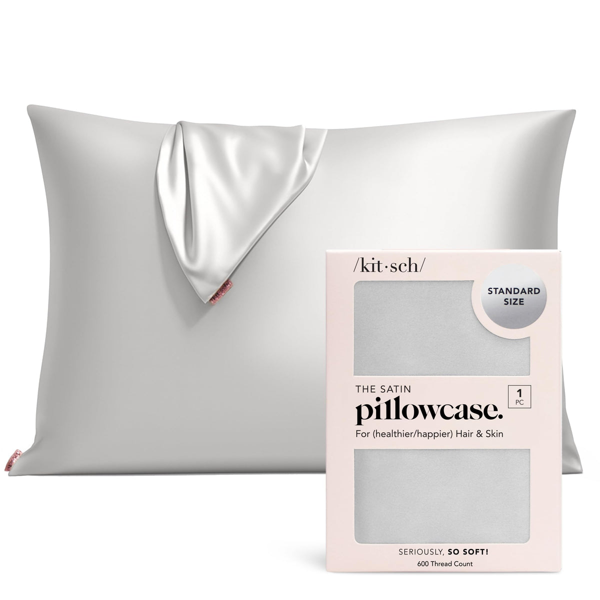 Kitsch satin pillowcase with zipper on standard pillow for secure sleep.