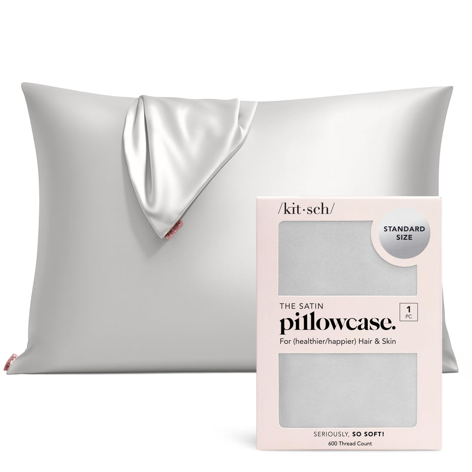 Kitsch satin pillowcase with zipper on standard pillow for secure sleep.
