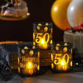 Kittmip black and gold decor enhances adult birthday party visuals.