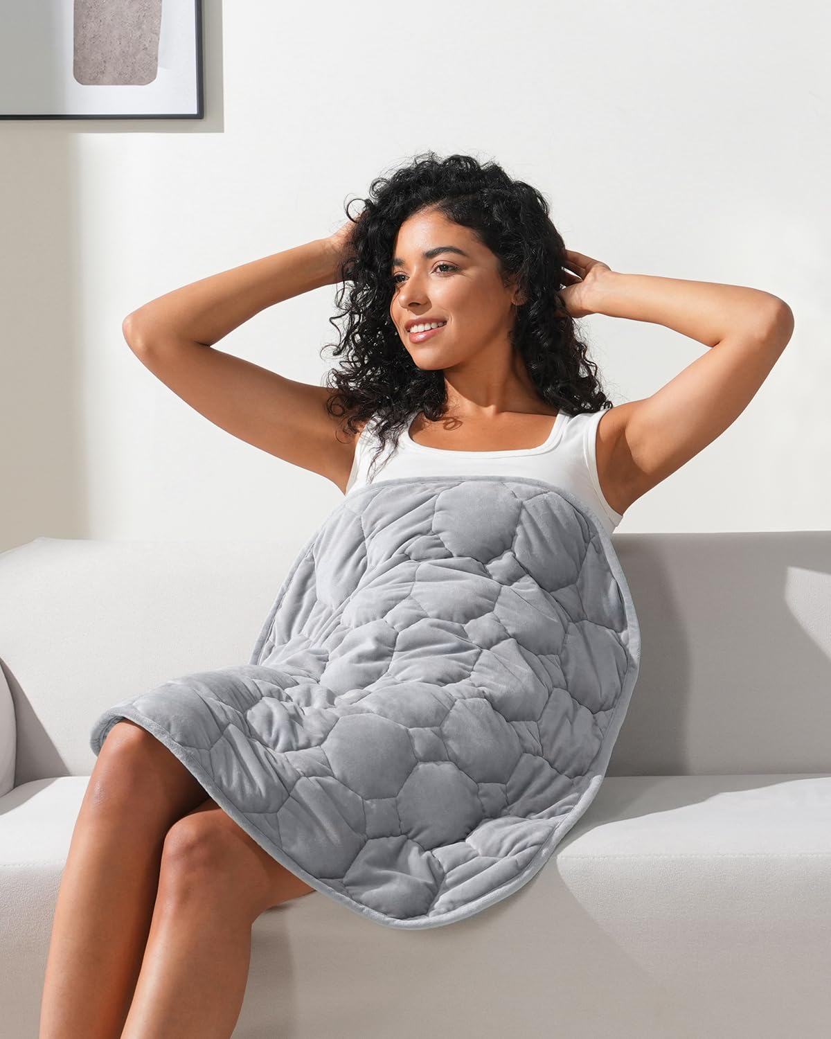 Kivik weighted lap blanket in gray folded, ideal for compact travel comfort.