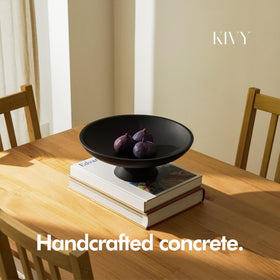 KIVY concrete fruit bowl on kitchen counter adds minimalist elegance and practical storage.