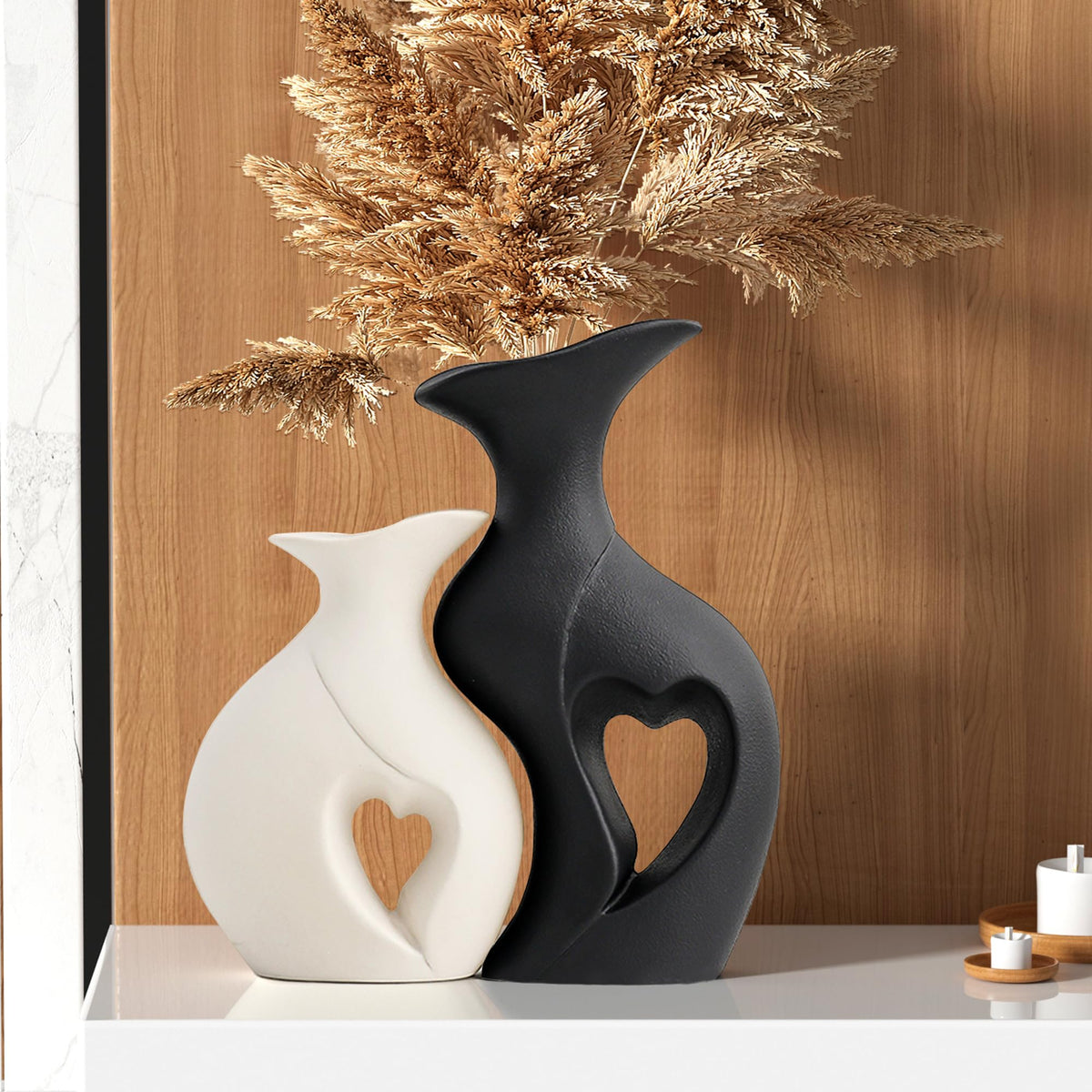 KKgoubz black and white heart vases on a shelf for modern romantic décor.