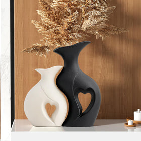 KKgoubz black and white heart vases on a shelf for modern romantic décor.