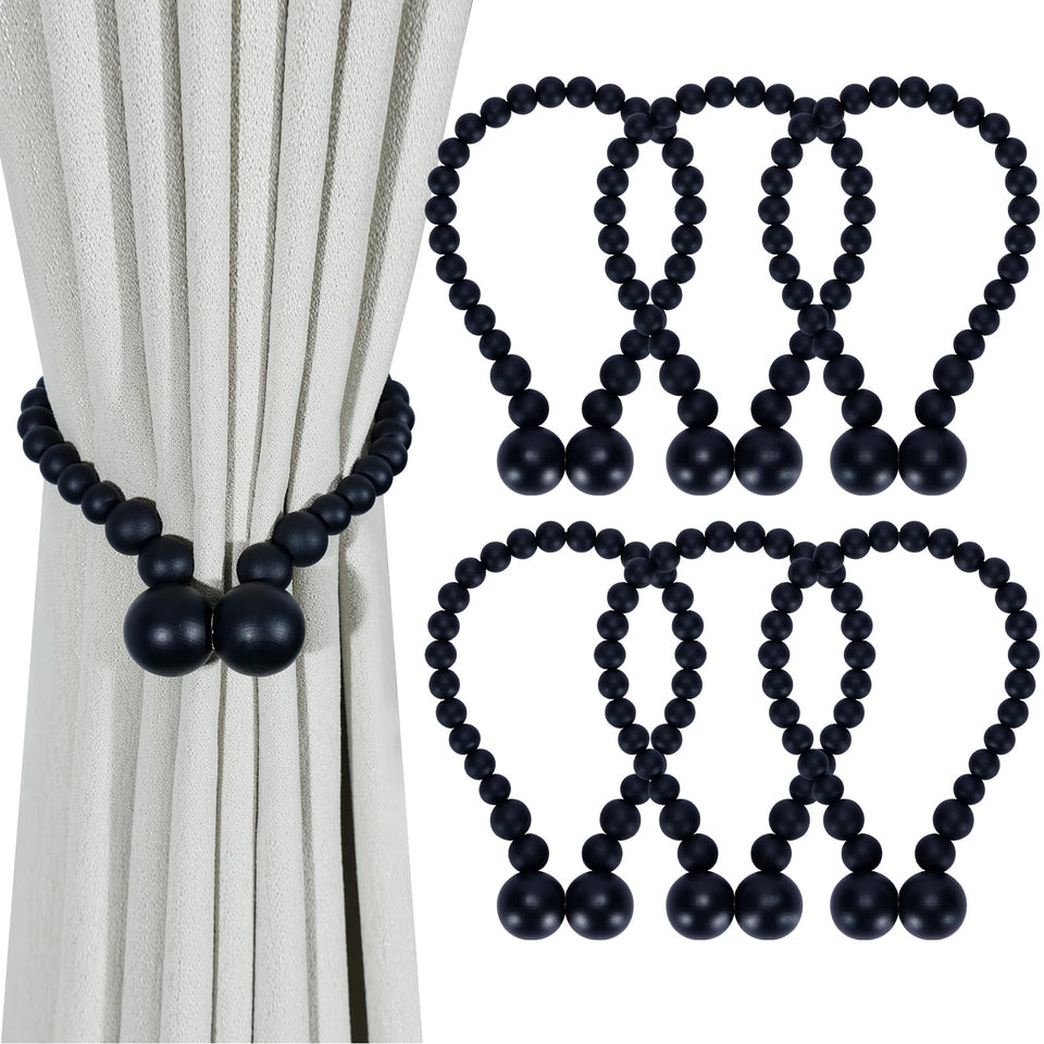 KLOGTSIND magnetic curtain tiebacks with wood beads securely holding curtains in a boho style.