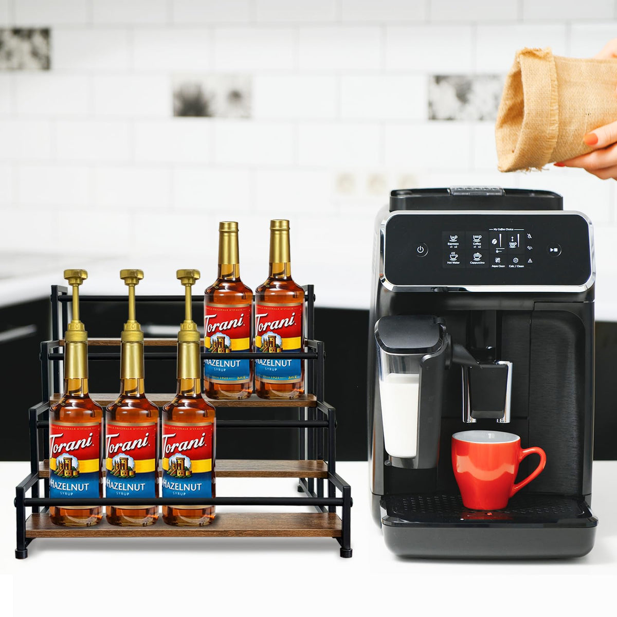 Klxuyuo coffee bar setup featuring a sleek syrup rack for quick dispensing.
