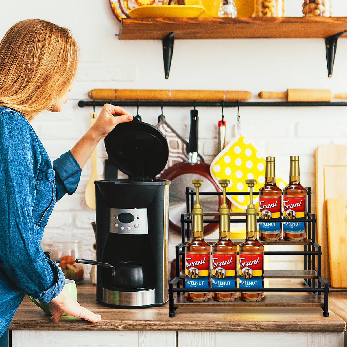 Klxuyuo coffee syrup rack showing rustic wood base and organized shelves.