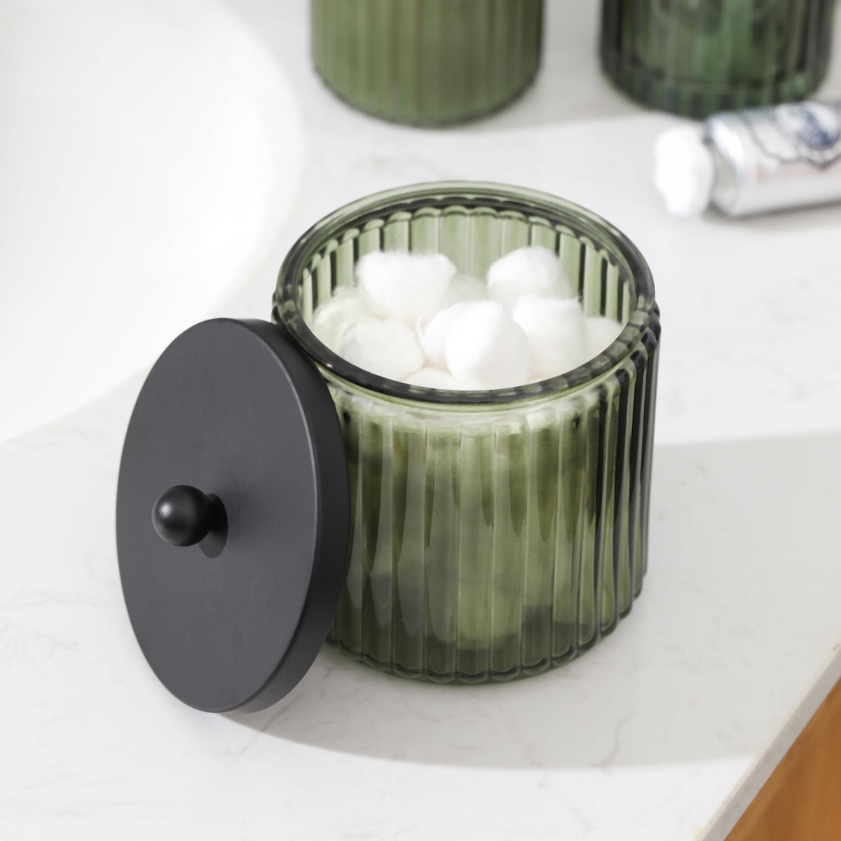 KMwares olive green glass embossed detail adds elegant texture to any bathroom.