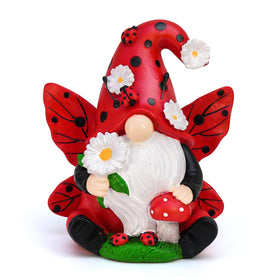 KnomeKo Ladybug Gnome in a garden with daisies for whimsical outdoor charm