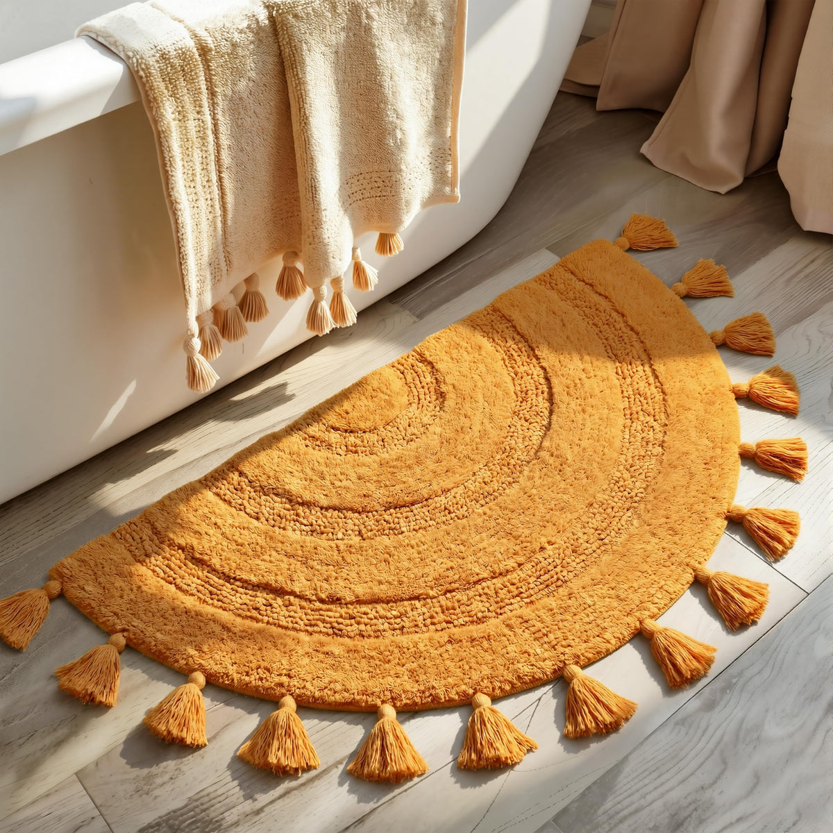 KOEXM Half Circle Boho Rug with tassels in front of sink for cozy feet.