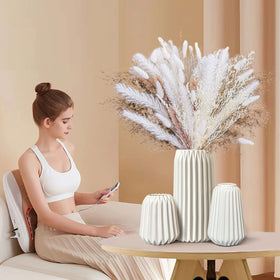 Kogxscej vases with smooth lines add an elegant touch to any table.