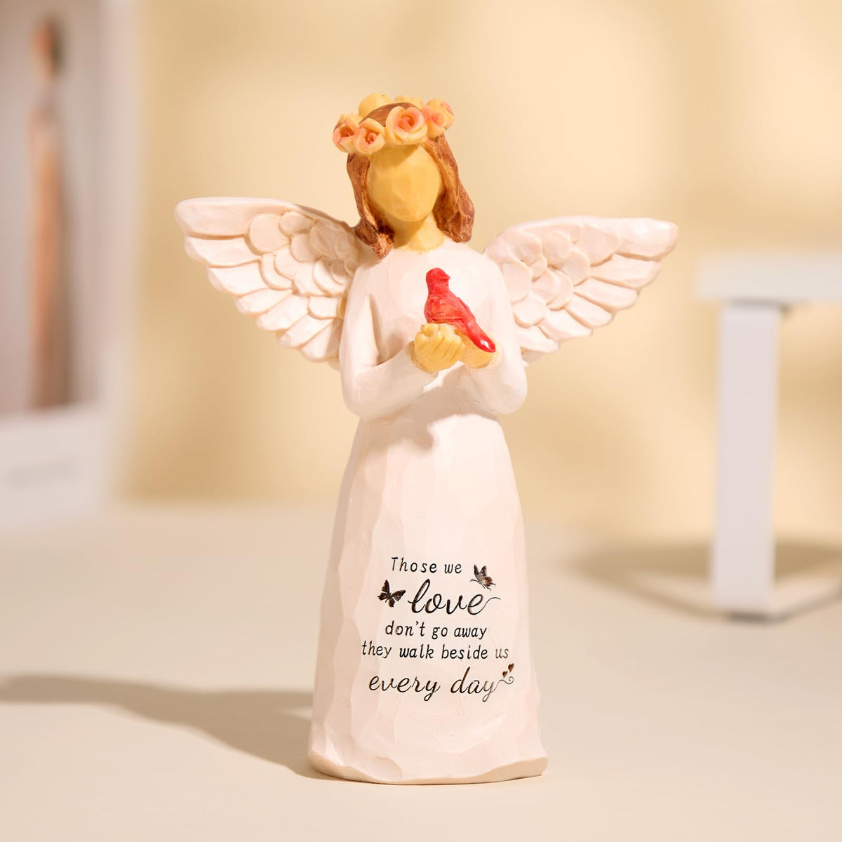 Kohehe angel figurine in cream dress with wings serves as a gentle remembrance keepsake.