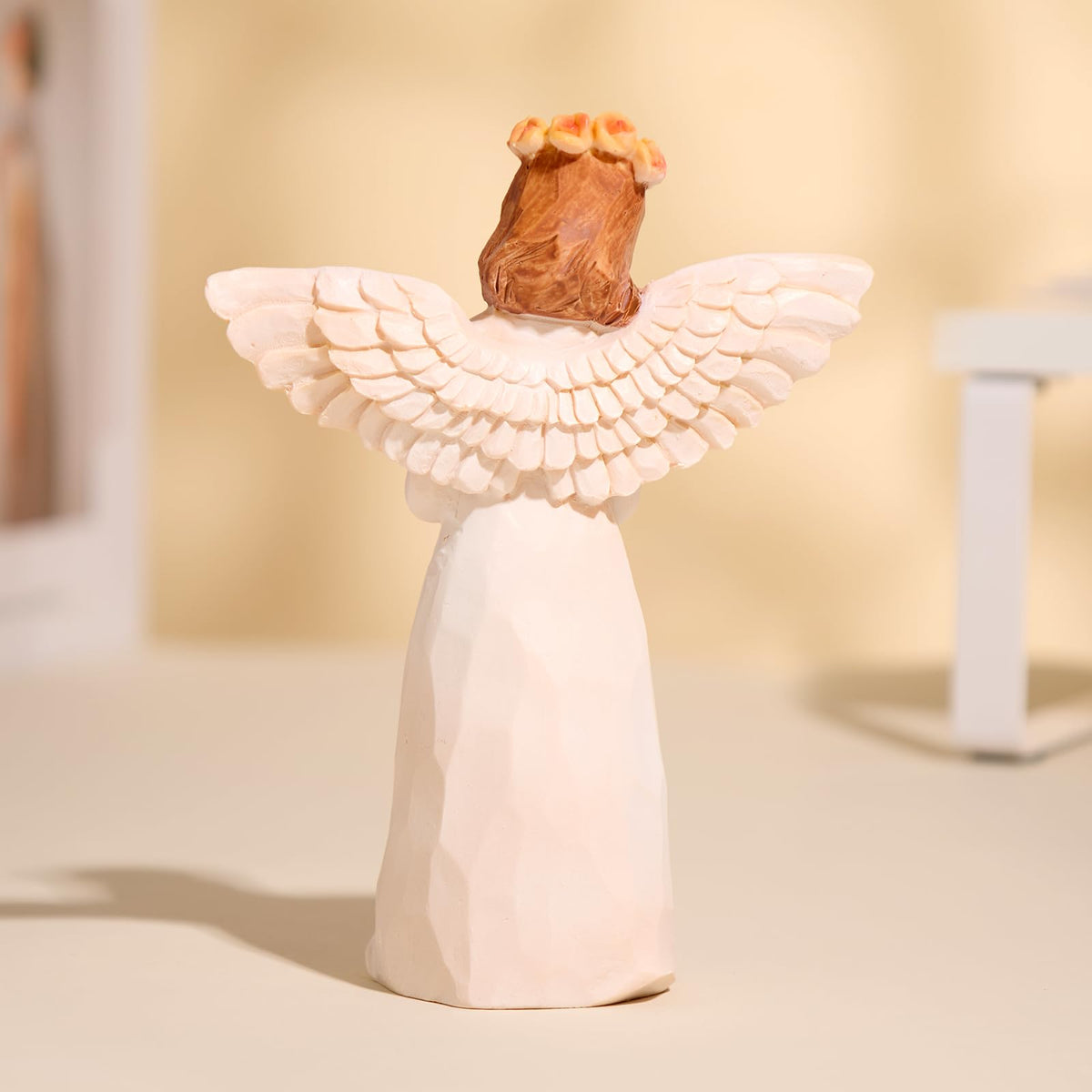 Hand-painted memorial figurine by Kohehe adds a serene focal point in living spaces.