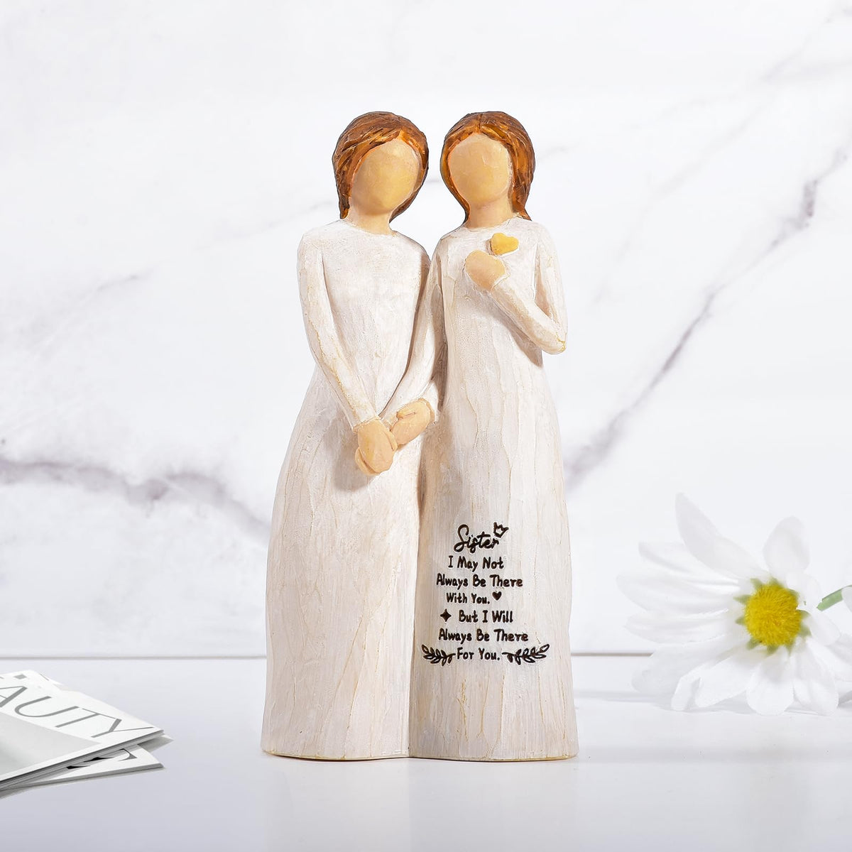 Kohehe sisters figurine on shelf display, adds warmth to any room