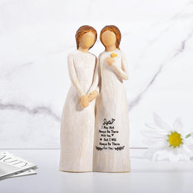 Kohehe sisters figurine on shelf display, adds warmth to any room