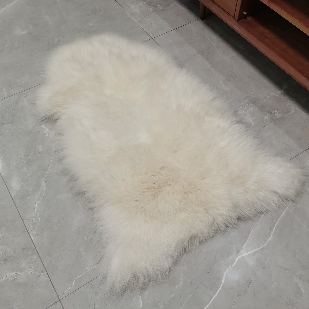 Kopal natural white sheepskin rug elevates decor with timeless elegance.
