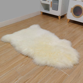 Kopal plush sheepskin floor rug adds rich texture to any room.