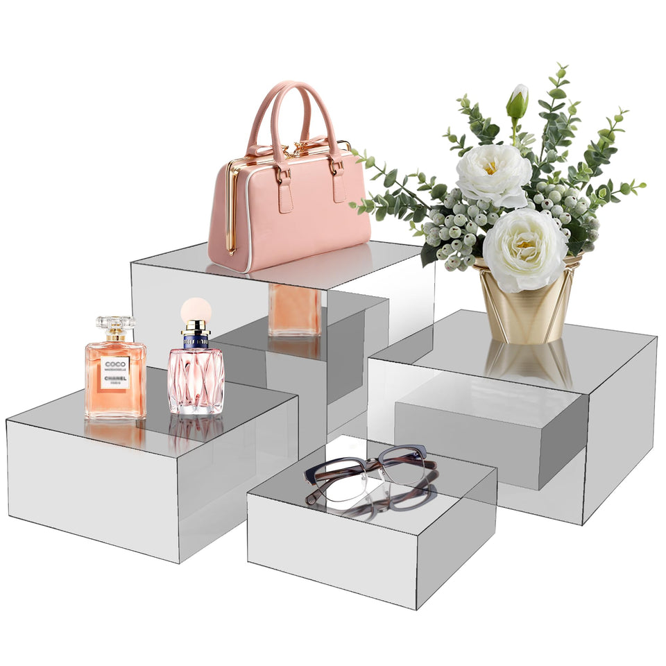 koretech acrylic risers 4pc set on a display shelf highlights items with mirrored elegance.