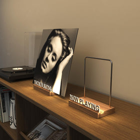 KORRTFID Now Playing sign beside the LED glow for immersive ambiance