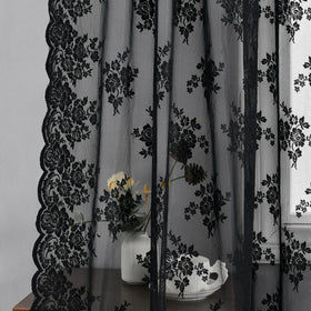 Kotile black sheer curtains softening sunlight in living room ambiance.