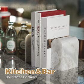 Koville Namib Fantasy bookends balance a shelf of movies and games.