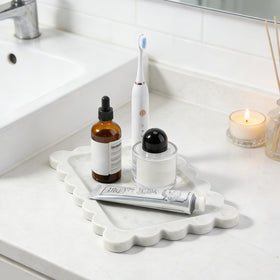 Koville Bianco Carrara tray suitable as a refined gift on a dresser.
