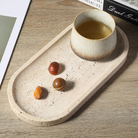 Koville travertine tray supports candles and small decor safely