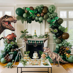 Kozee dinosaur arch kit creates jungle party vibes with hunter green balloons.