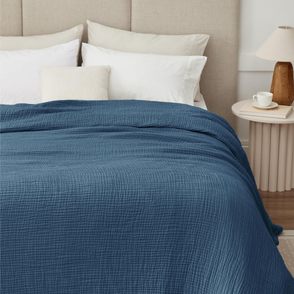 Kozyhvn muslin blanket 66x90 in breathable cotton for all seasons.