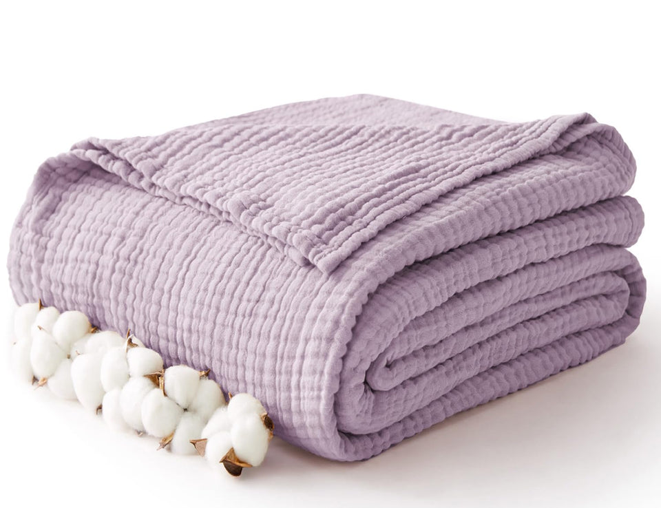 Kozyhvn muslin blanket unfolded, breathable weave for cool all-season comfort.