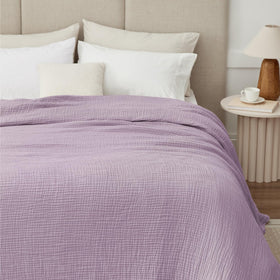Kozyhvn muslin blanket closeup weave, highlighting soft texture and coziness.