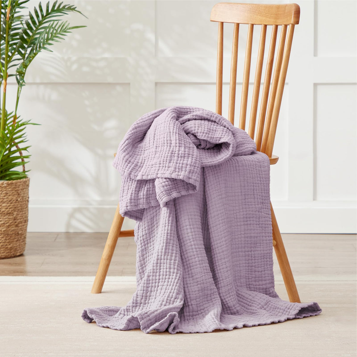 Kozyhvn lavender blanket draped, showcasing boho style and relaxing color.