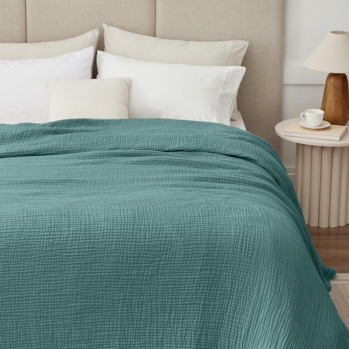 Kozyhvn teal muslin blanket on bed demonstrates versatile decor