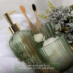 Kukikan designer green glass apothecary jar stores cotton swabs neatly.