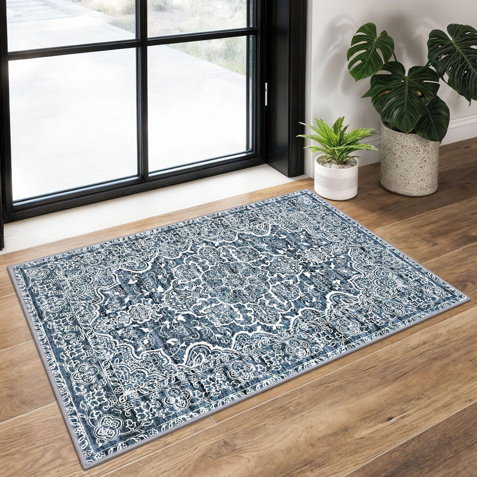 KUTA Entryway rug with blue floral print adds durable style to busy entrances.