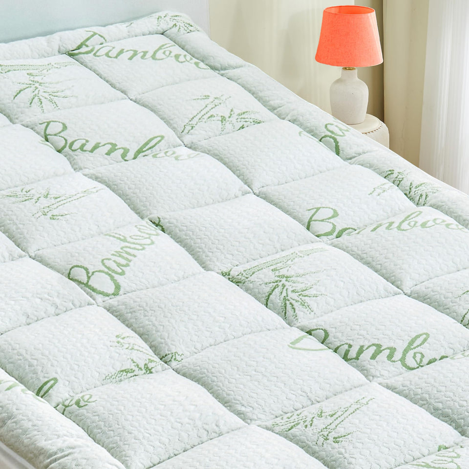 KUTUU Twin XL mattress pad cover with bamboo-topper on bed for cloud-soft comfort.
