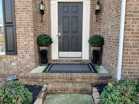 kyesyes outdoor decor setup featuring two boxwood balls