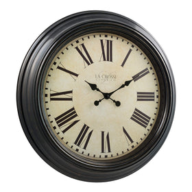 La Crosse Maxwell 23in clock dial closeup demonstrates legible Roman numerals on off-white face.