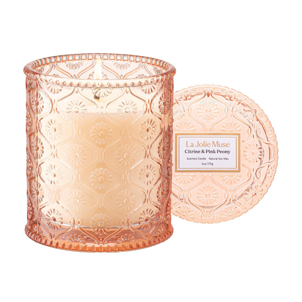 La Jolie Muse Citrine & Pink Peony candle in embossed jar elevates decor with soft fragrance.