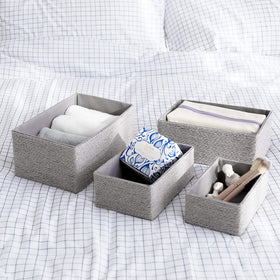 La Jolie Muse space-saving bins classify keys, scarves, and spa products.