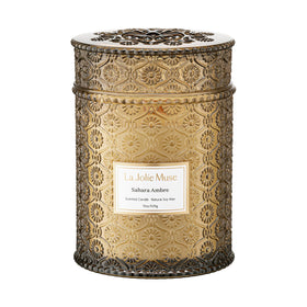 LA JOLIE MUSE Sahara Amber Candle embossed-daisy jar enhances cozy decor.