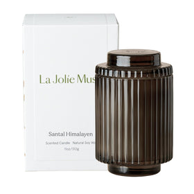 Gift-ready La Jolie Muse Santal Himalayen candle shown with decorative packaging.