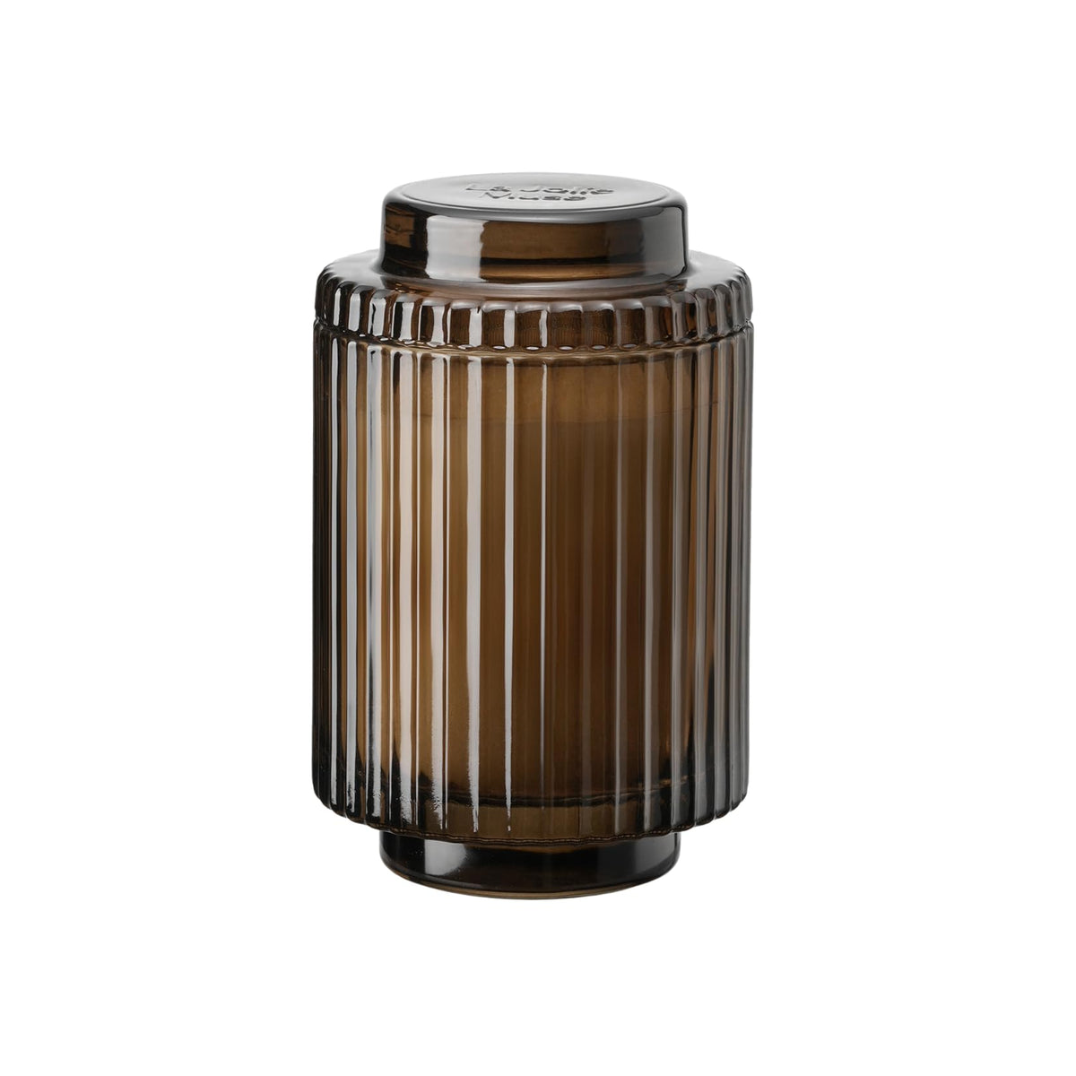 La Jolie Muse Santal Himalayen candle in glass jar glows for cozy ambiance.
