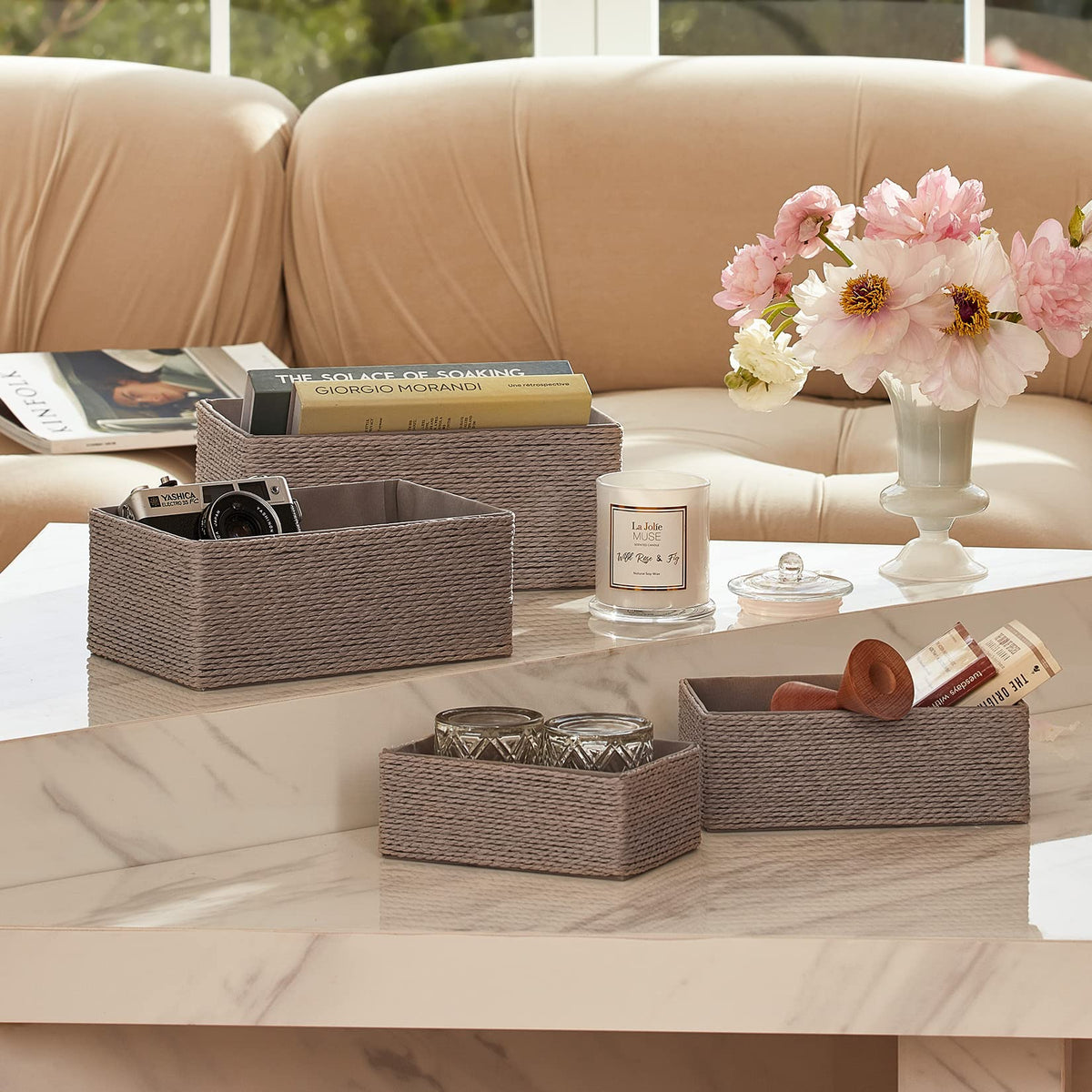 La Jolie Muse four gray baskets in varying sizes for versatile closet and makeup storage.