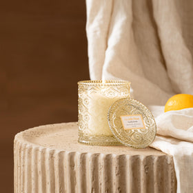 LA JOLIE MUSE Vanilla Bomb embossed daisy jar elevates room ambiance.