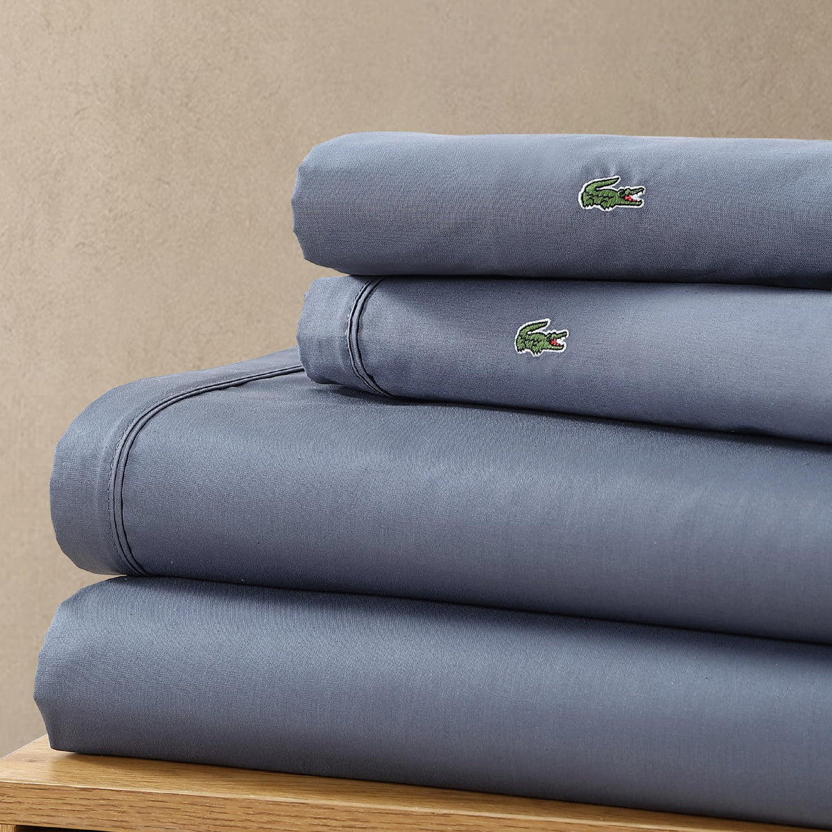 Lacoste all-season breathable threads—cool in summer and warm in cooler months.