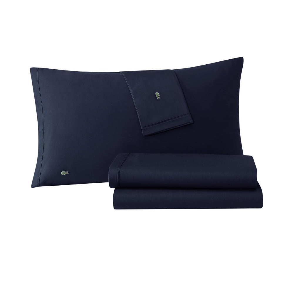 Lacoste percale flat sheet close-up with crisp weave for breathable comfort.