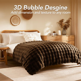 L'AGRATY 60x80 inch cocoa brown blanket adds soft, stylish warmth to any sofa.