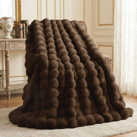 L'AGRATY faux rabbit fur blanket with bubble texture for luxurious warmth.